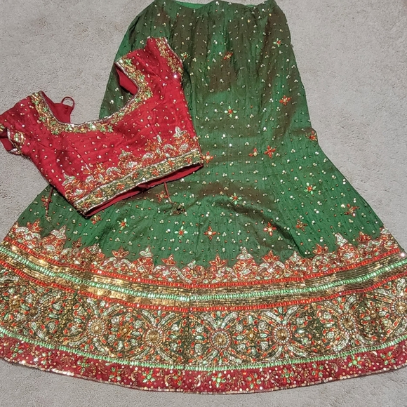 Elegant Green And Red Lengha Choli With Stones And Sequins - Picture 1 of 8